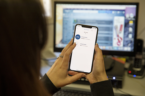 woman holding her smartphone