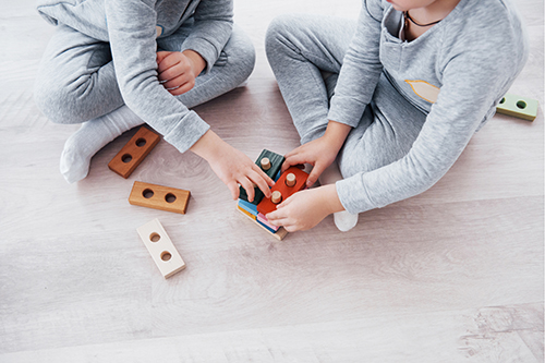 children playing with wooden toys